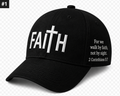 Black faith cap with white FAITH lettering, a cross, and the 2 Corinthians 5:7 message