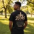 Psalm 20:46 black tee – young Black male back view in sunny park